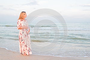 Beautiful happy young pregnant woman