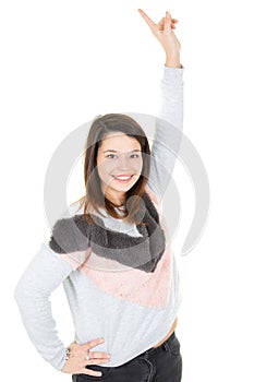 Beautiful happy young woman in grey pink winter sweater and hands in the air