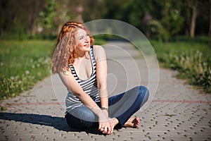 Beautiful happy young woman in the park