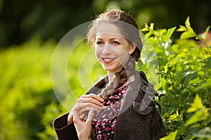 Beautiful happy young woman with pigtail