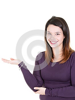 Beautiful happy young woman presenting in hand blank advertising