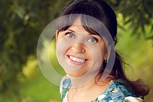 Beautiful happy young woman smiles white teeth