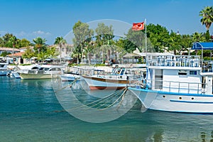 Beautiful harbour with boats in Side resort town at sunset - Antalya, Turkey