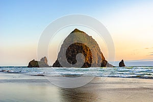 Beautiful Haystack Rock, famous natural landmark of the Pacific Coast, at sunset, Cannon Beach, Oregon Coast