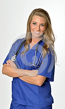 Beautiful healthcare professional in blue scrubs