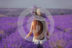 Beautiful healthy long hair. Back view of Young teen girl in hat