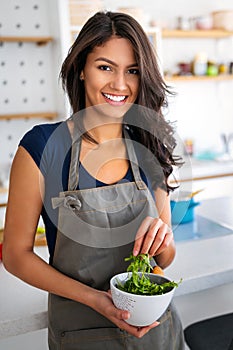 Beautiful healthy woman eating salad. Dieting, healthy lifestyle concept