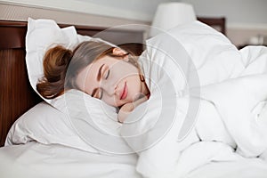 Beautiful healthy woman sleep in hotel number