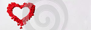 Beautiful heart banner frame of red rose heart shape petals isolated on white.Valentines day, love concept.Copy space