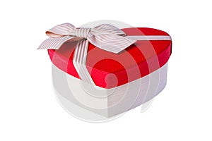 Beautiful Heart-shaped red white gift box with bow. Happy Women`s Day or Christmas and New Year present gift. Isolated