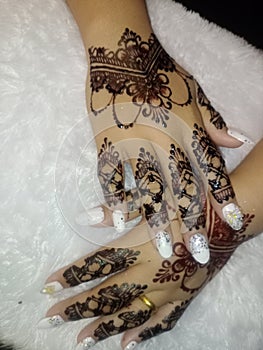 beautiful henna on the hands of the bride