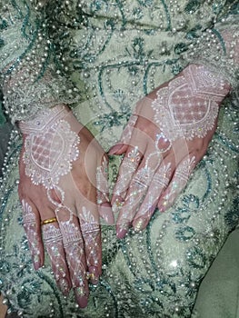 Beautiful henna in the hands of the bride