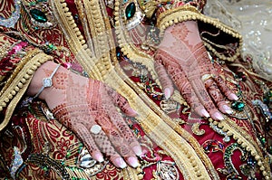 Beautiful henna patterns on hands of bride