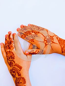 Beautiful henna tattoo Mehndi design tattoos stencils prints on a girl female backhands wedding and eid occasion event photo