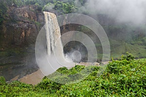 Beautiful hidden Ekom Waterfall deep in the tropical rain forest of Cameroon, Africa