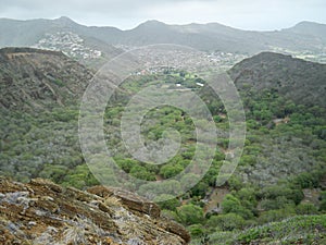 Beautiful high angle shot of a village surrounded by a mountainous scenery in Hawaii