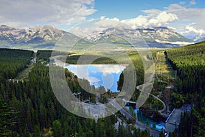 Beautiful high mountains of the Canadian Rockies reflecting in an alpine lake along the Icefields Parkway between Banff and Jasper