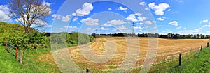 Beautiful high resolution summer landscape with fields, green grass and a stunning summer sky taken in northern germany