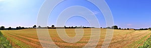 Beautiful high resolution summer landscape with fields, green grass and a stunning summer sky taken in northern germany