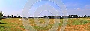 Beautiful high resolution summer landscape with fields, green grass and a stunning summer sky taken in northern germany