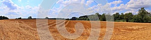 Beautiful high resolution summer landscape with fields, green grass and a stunning summer sky taken in northern germany