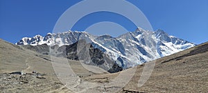 Beautiful high snow capped mountain peaks under blue sky in Chukhung at Mount Everest in Nepal