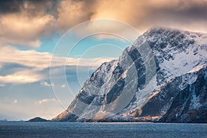 Beautiful high snow covered mountains at sunset in winter