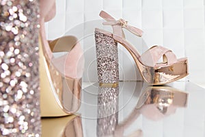Beautiful high and thin golden stiletto heel shoes.