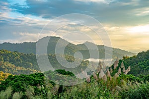 beautiful hight mountain valley sunset scene with cloudy sky background.