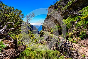 Beautiful hiking trail from Pico do Arieiro to Pico Ruivo, Madeira island. Footpath PR1 - Vereda do Areeiro. On sunny summer day