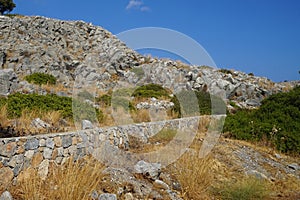 Beautiful hilly landscape with summer vegetation in August in the vicinity of Pefki. Rhodes Island, Dodecanese, Greece