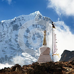 Beautiful himalayas with buddhist stupa and prayer flags