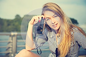 Beautiful Hipster Girl with Photo Camera