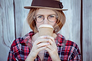 beautiful hipster woman drinking coffee