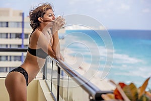 Beautiful Hispanic Brunette Model Lounging Around At A Resort