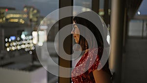 Beautiful hispanic businesswoman in glasses, captivating cityscape view from skyscraper window in japan\'s urban skyline