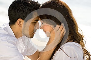 Beautiful Hispanic couple laughing and smiling.