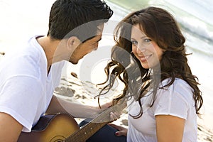 Beautiful Hispanic couple laughing and smiling.