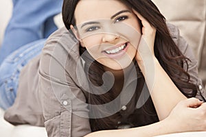 Beautiful Hispanic Woman Laying on Sofa Relaxing