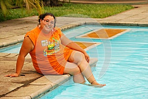 Beautiful Hispanic Woman by the pool