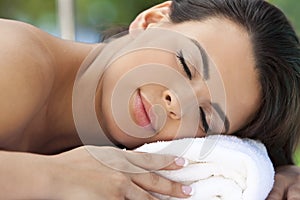 Beautiful Hispanic Woman Relaxing At Health Spa