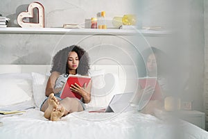 Beautiful Hispanic Woman Studying At Home With Laptop Pc