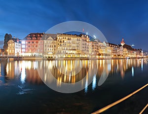 Beautiful historic city center of Lucerne with famous buildings and promanade during night