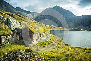 A beautiful, historic stone buildings in the mountains of Folgefonna National Park in Norway. Old houses with grass roofs near the