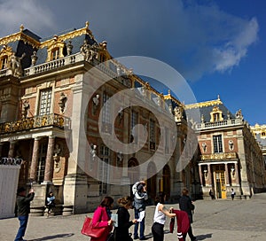 Beautiful historical buildings and tourists in the Chateaux de Versailles in paris in France