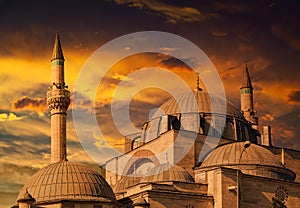 Beautiful historical Sultan Selim Camii in front of dramatic sunset in Konya photo