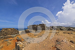 Beautiful historical view of Caribbean coastline with ruins of gold smelter Bushiribana.