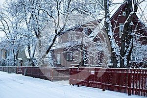 Beautiful historical wooden urban building in Tallinn under snow