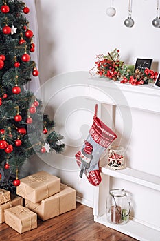 Beautiful holdiay decorated room with Christmas tree and presents under it. New Year decorations