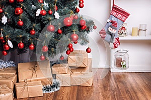 Beautiful holdiay decorated room with Christmas tree and presents under it. New Year decorations
